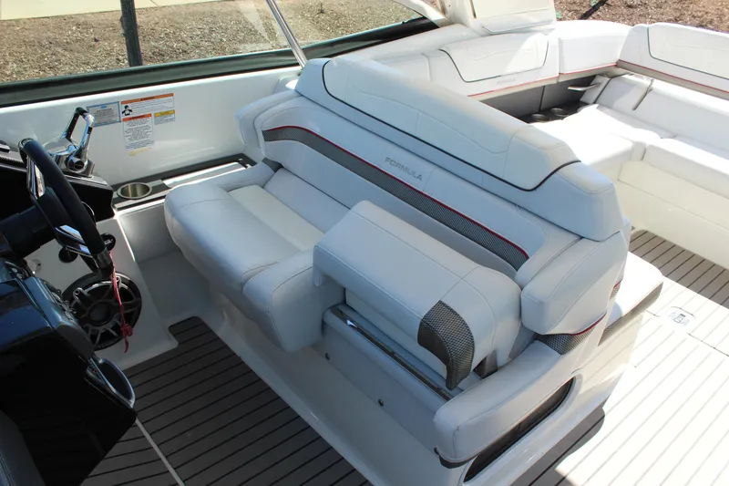 Slide: The Image of 2018 Formula 350 Crossover Bowrider interior with luxurious white seating and modern helm. - 13