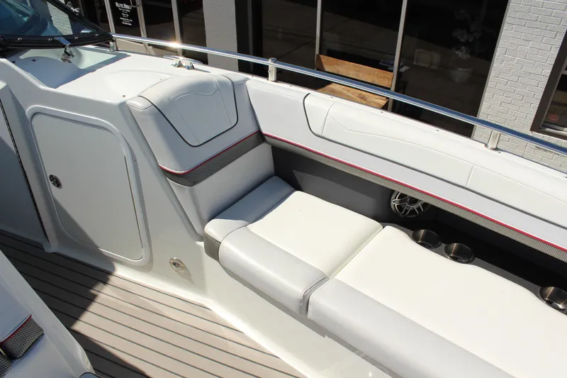 Slide: The Image of 2018 Formula 350 Crossover Bowrider interior with white seating and cup holders. - 18