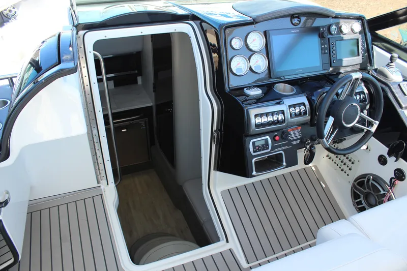 Slide: The Image of 2018 Formula 350 Crossover Bowrider cockpit with modern controls and cabin entrance. - 19