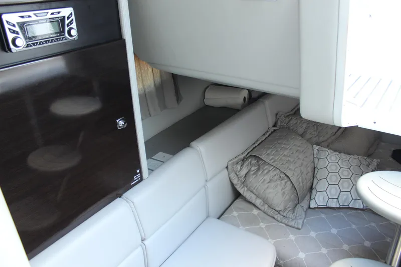 Slide: The Image of 2018 Formula 350 Crossover Bowrider cabin interior with seating and stereo system. - 22