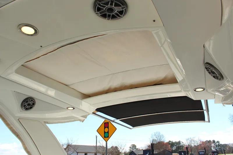 Slide: The Image of 2018 Formula 350 Crossover Bowrider boat canopy with speakers and lighting. - 26