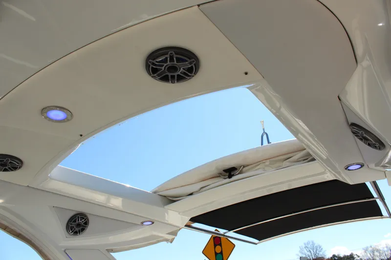 Slide: The Image of 2018 Formula 350 Crossover Bowrider roof with speakers and lighting, open sky view. - 27