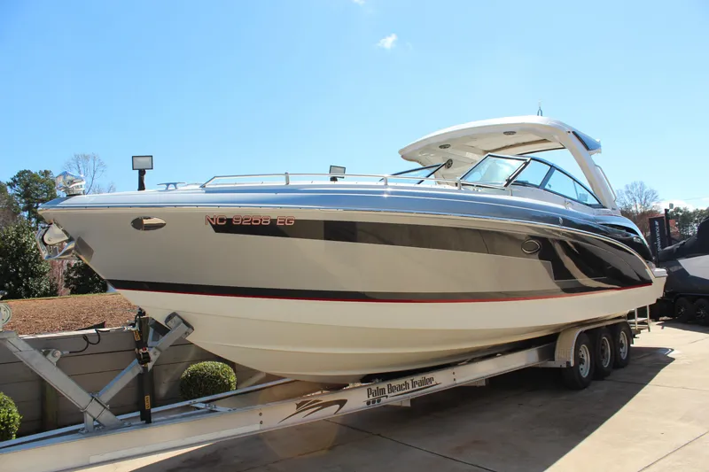 Slide: The Image of 2018 Formula 350 Crossover Bowrider on trailer, sleek design, sunny day. - 3