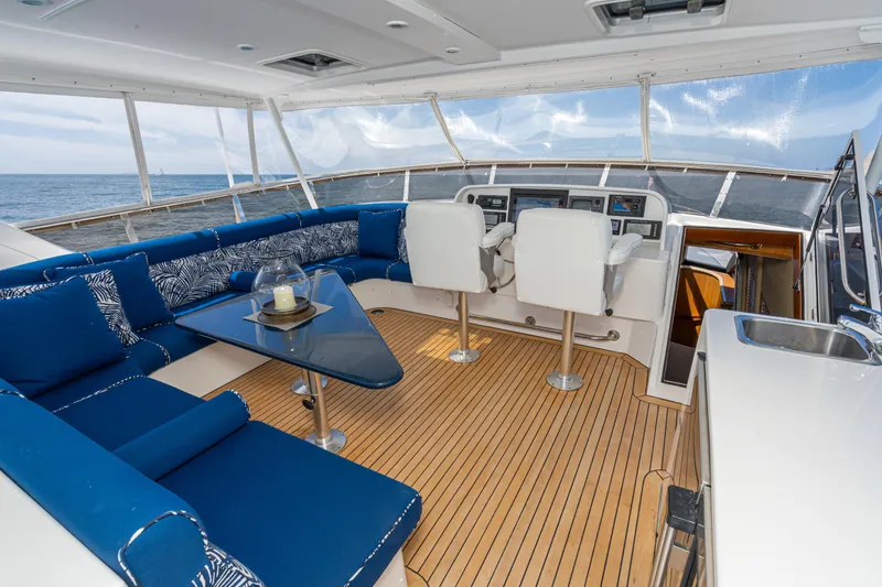 Slide: The Image of Luxurious 2001 West Bay Sonship yacht interior with blue seating and modern helm. - 11