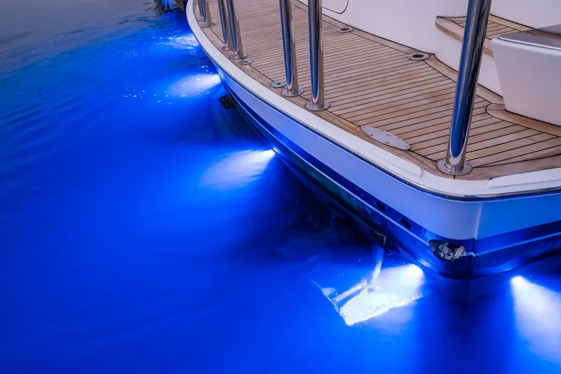 Slide: The Image of 2001 West Bay Sonship yacht with blue underwater lights and teak deck. - 15