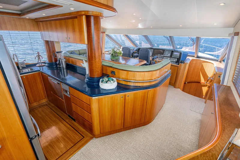 Slide: The Image of Luxurious 2001 West Bay Sonship yacht interior with elegant wood finishes and modern amenities. - 17