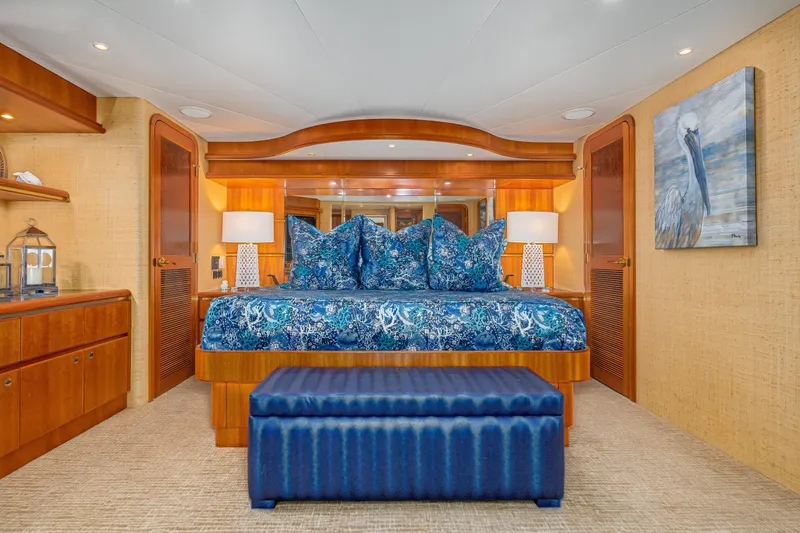 Slide: The Image of Luxurious 2001 West Bay Sonship yacht bedroom with elegant blue decor and wooden accents. - 20