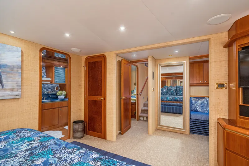 Slide: The Image of Luxurious 2001 West Bay Sonship yacht interior with elegant wood finishes and cozy bedroom. - 23