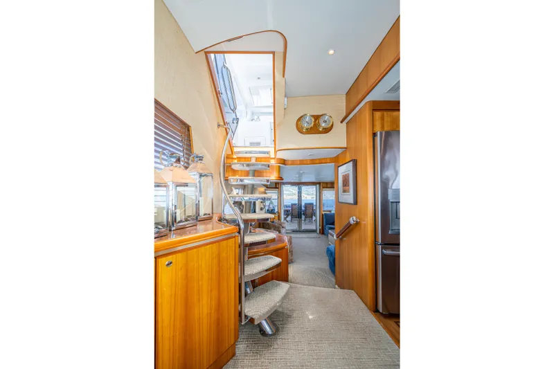 Slide: The Image of Interior of 2001 West Bay Sonship yacht with elegant wooden staircase and modern decor. - 25