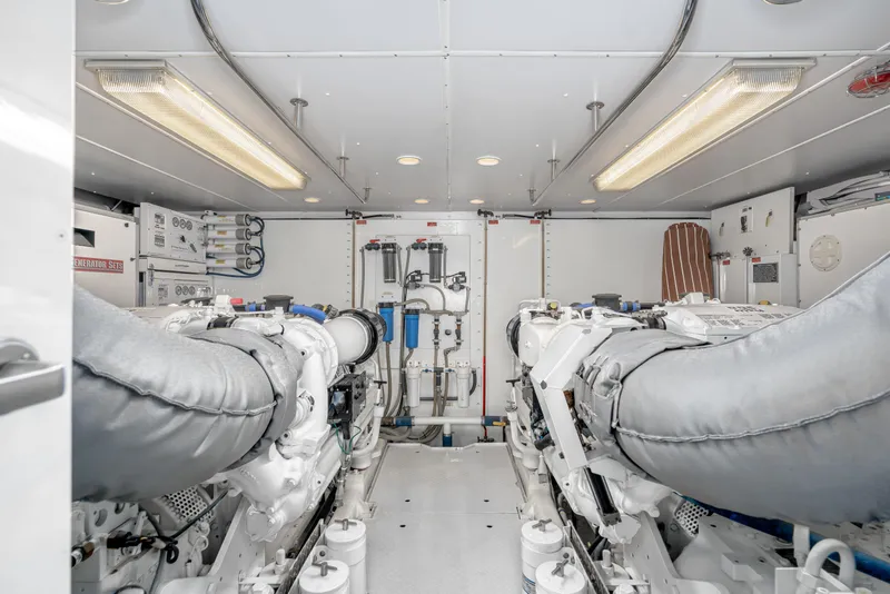Slide: The Image of Engine room of 2001 West Bay Sonship yacht, featuring dual engines and modern equipment. - 40