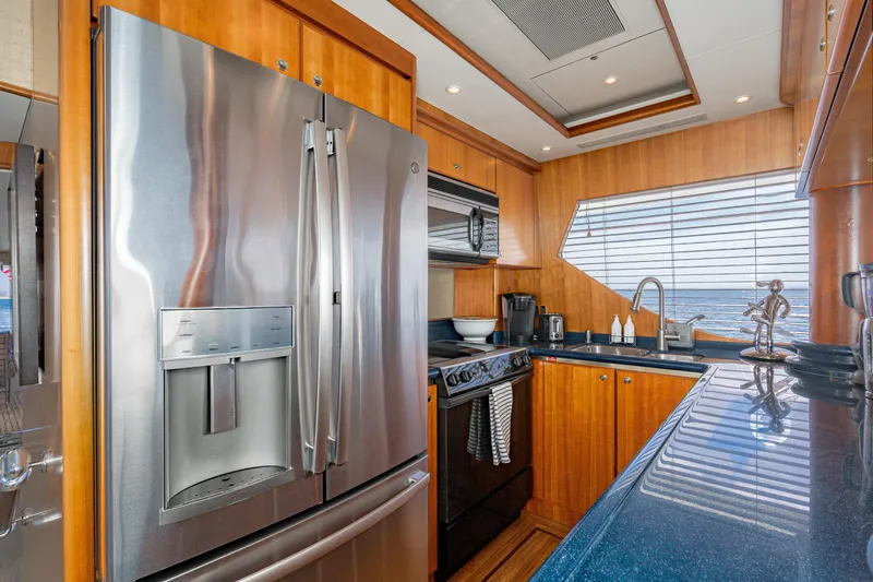 Slide: The Image of Luxurious 2001 West Bay Sonship yacht kitchen with modern appliances and ocean view. - 6
