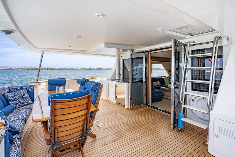 Slide: The Image of Luxurious 2001 West Bay Sonship yacht deck with elegant seating and ocean view. - 8