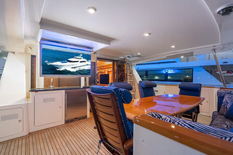 Slide: The Image of Luxurious 2001 West Bay Sonship yacht interior with elegant dining area and modern amenities. - 9