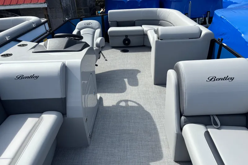 Slide: The Image of 2026 Bentley Pontoons Legacy 220 Cruise XL interior with luxurious seating and modern design. - 13