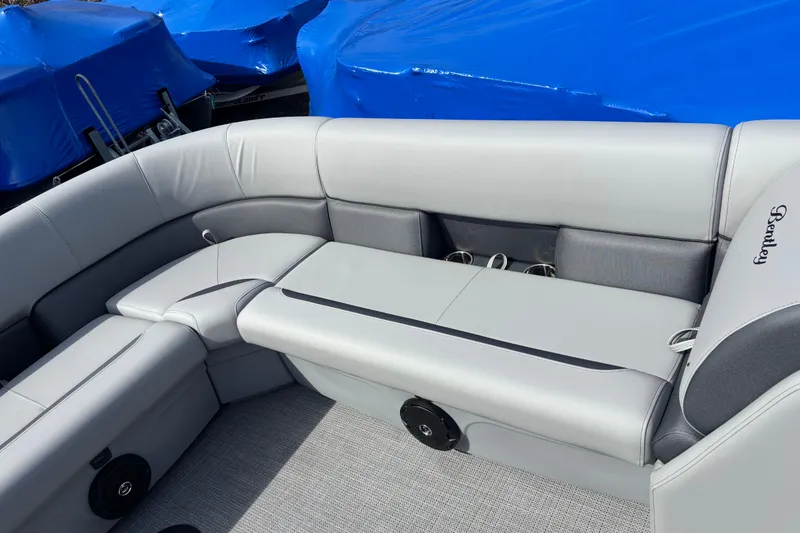 Slide: The Image of 2026 Bentley Pontoons Legacy 220 Cruise XL interior with gray seating and cup holders. - 17