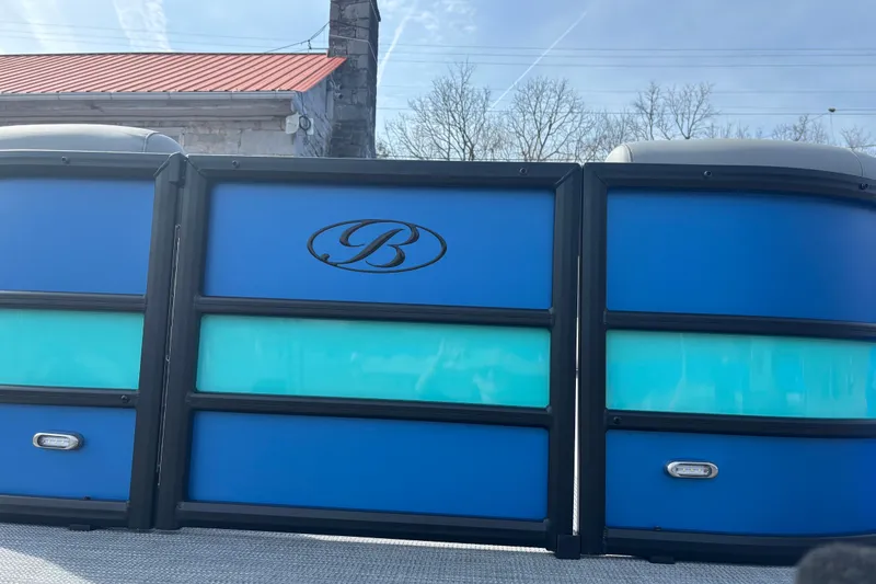 Slide: The Image of 2026 Bentley Pontoons Legacy 220 Cruise XL with blue and teal paneling. - 3