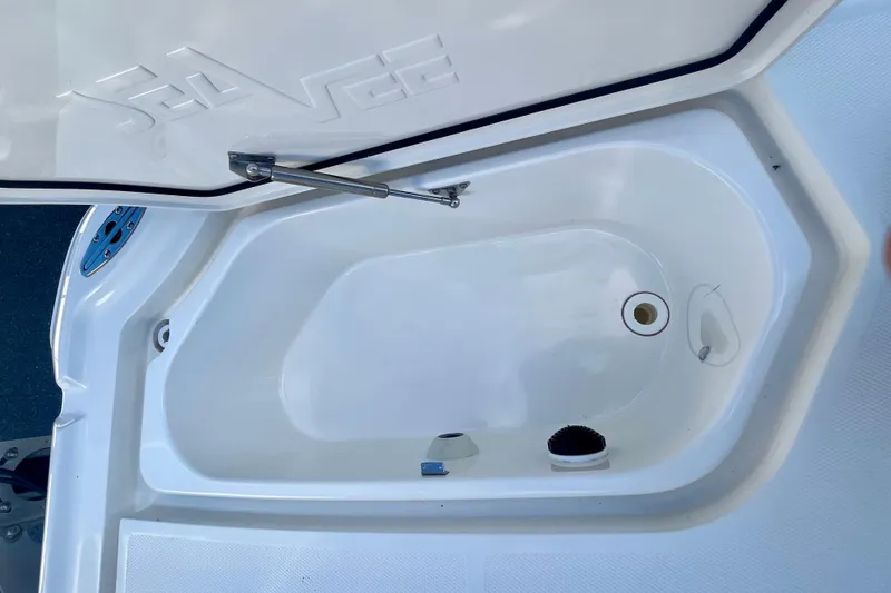 Slide: The Image of Open storage compartment on 2018 SeaVee 270Z boat, showcasing interior design. - 12