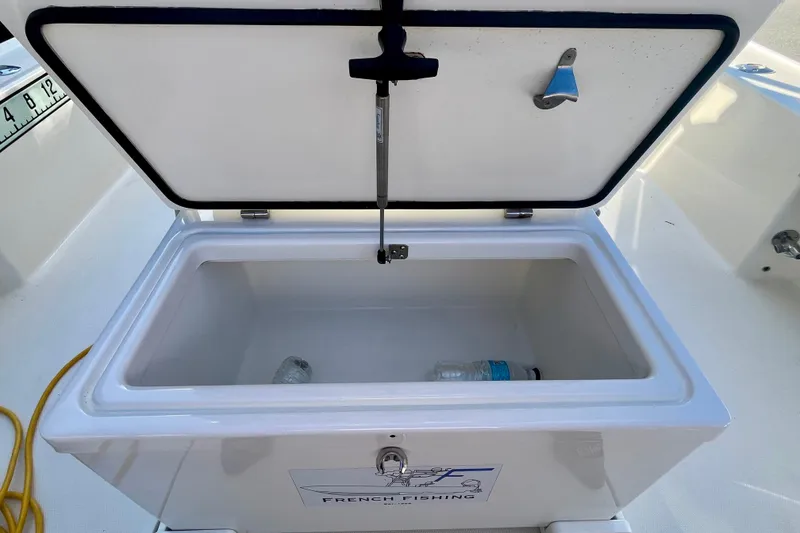 Slide: The Image of Open storage compartment on 2018 SeaVee 270Z boat with a water bottle inside. - 16
