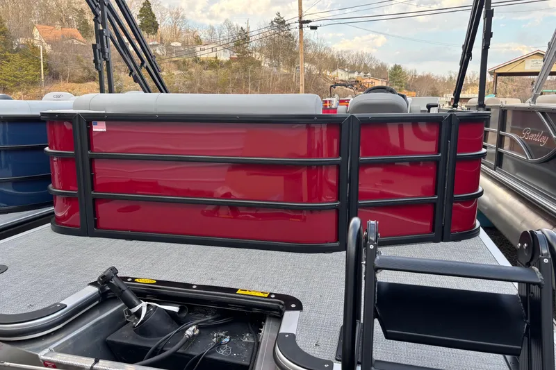 Slide: The Image of 2026 Bentley Pontoons Legacy 220 Cruise XL, red exterior, docked on a sunny day. - 1