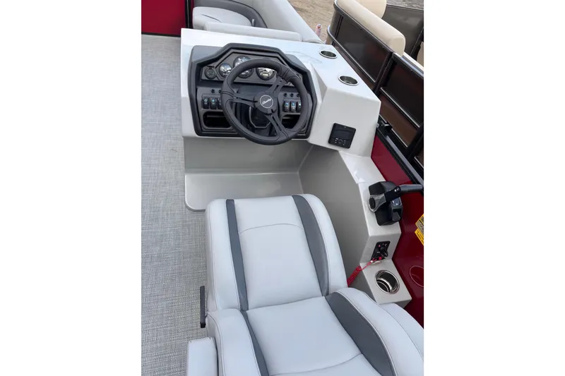 Slide: The Image of 2026 Bentley Pontoons Legacy 220 Cruise XL interior with steering console and seating. - 7