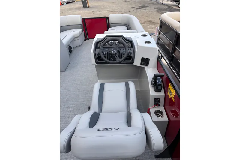 Slide: The Image of 2026 Bentley Pontoons Legacy 220 Cruise XL interior with steering console and seating. - 8