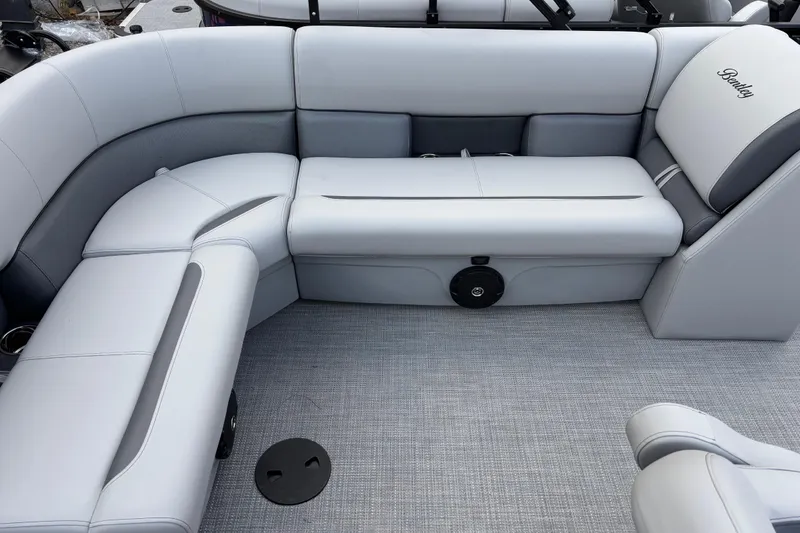 Slide: The Image of 2026 Bentley Pontoons Legacy 220 Cruise XL interior with luxurious seating and modern design. - 9