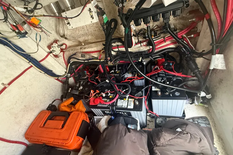 Slide: The Image of Electrical system with batteries and wiring in a 2022 Eastward 30 boat. - 100