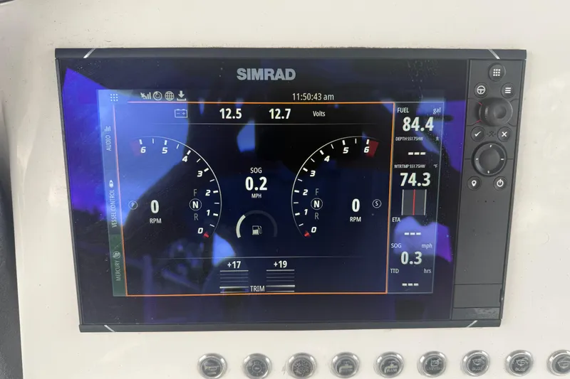 Slide: The Image of Simrad marine display showing speed, RPM, fuel, and voltage on Eastward 30, 2022 model. - 105
