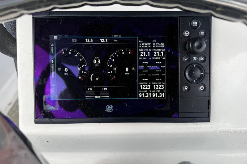 Slide: The Image of Eastward 30 boat dashboard display showing navigation and engine data, 2022 model. - 107