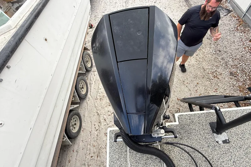 Slide: The Image of Overhead view of Eastward 30 boat engine, 2022 model, with a person nearby. - 114