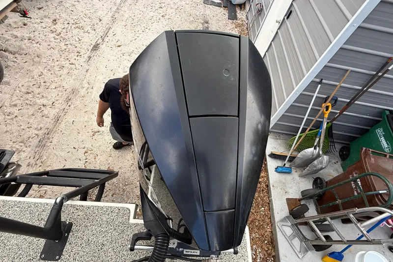 Slide: The Image of Overhead view of a 2022 Eastward 30 boat engine near a storage area. - 115