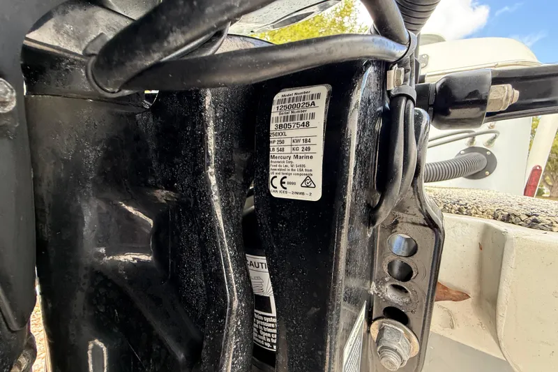 Slide: The Image of Close-up of a 2022 Eastward 30 boat engine with visible serial number label. - 125