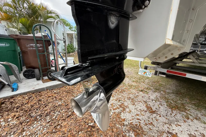 Slide: The Image of Outboard motor propeller of 2022 Eastward 30 boat, parked on a trailer. - 127