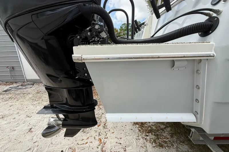 Slide: The Image of Outboard motor on 2022 Eastward 30 boat, showing engine and transom details. - 130