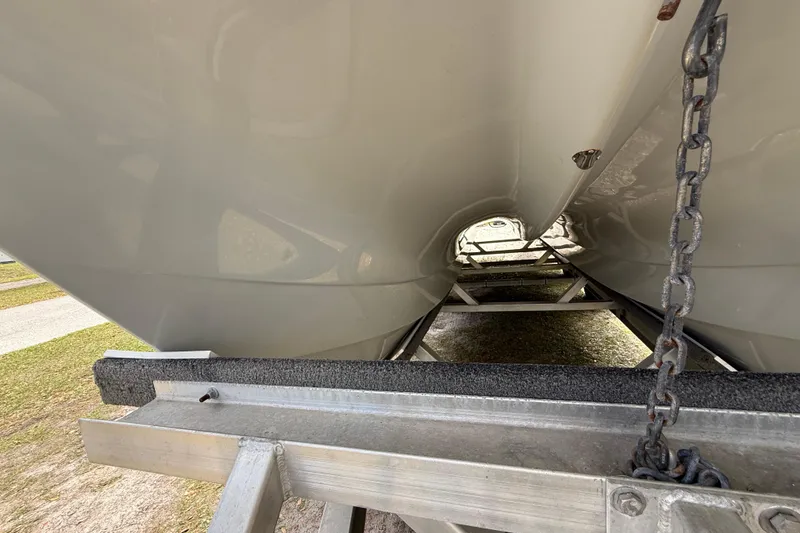 Slide: The Image of Underside view of 2022 Eastward 30 boat on trailer, showcasing hull design. - 17