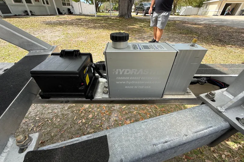Slide: The Image of HydraStar trailer brake actuator on Eastward 30, 2022 model, parked outdoors. - 24