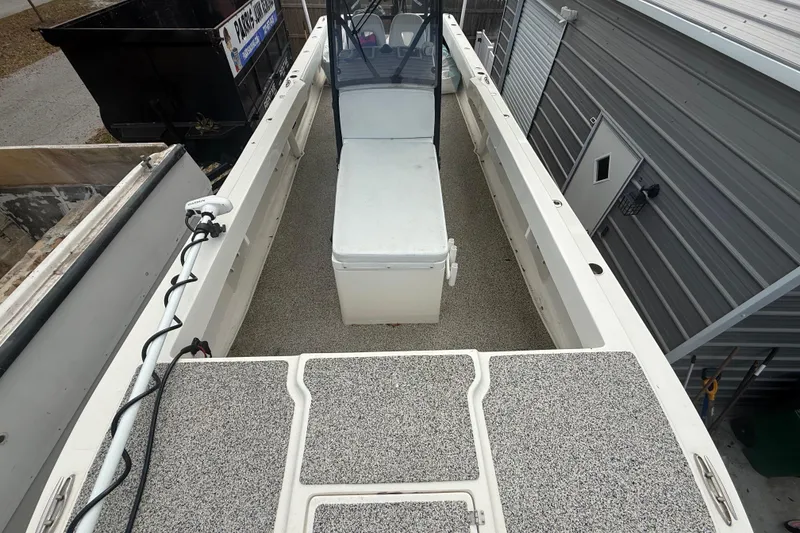 Slide: The Image of 2022 Eastward 30 boat interior with spacious deck and seating area. - 27