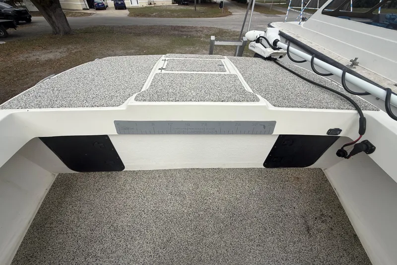 Slide: The Image of 2022 Eastward 30 boat deck with textured surface and measuring ruler. - 35