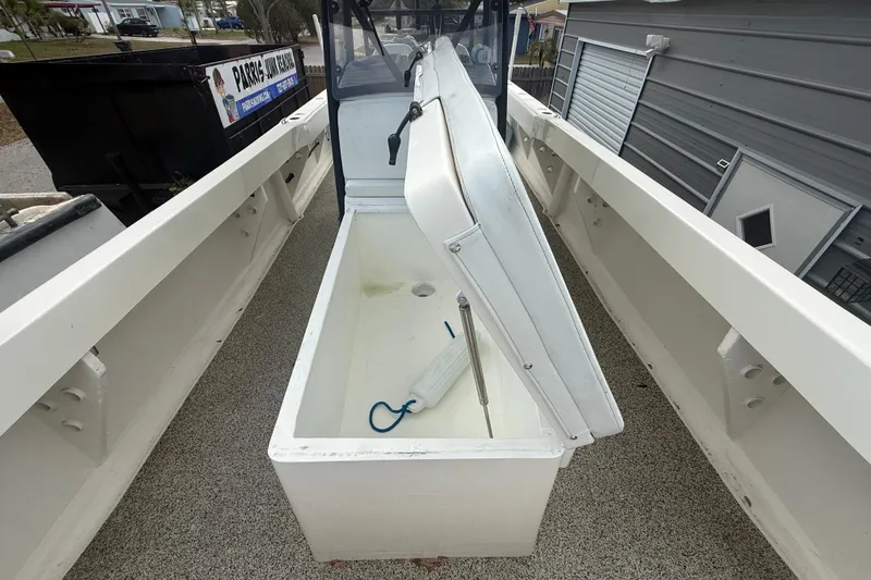 Slide: The Image of Open storage compartment on a 2022 Eastward 30 boat, showcasing interior space. - 42
