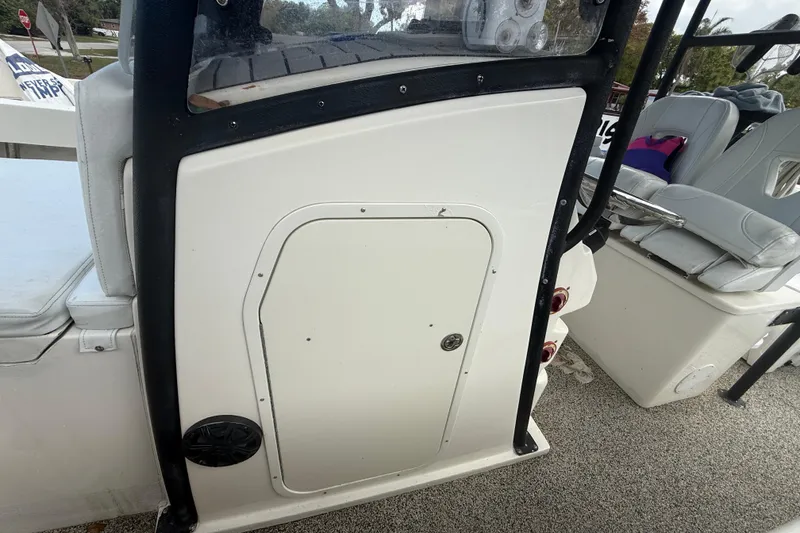 Slide: The Image of 2022 Eastward 30 boat interior with seating and storage compartment. - 49