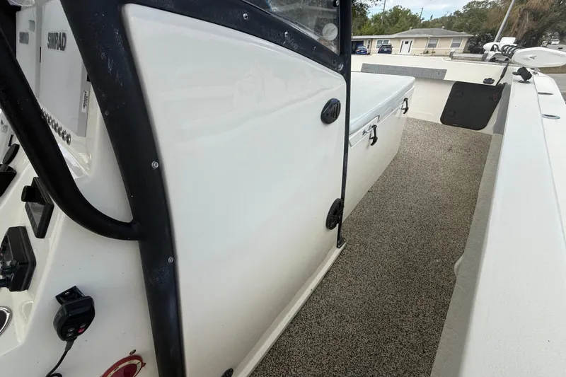 Slide: The Image of 2022 Eastward 30 boat interior with Simrad electronics and storage compartment. - 51