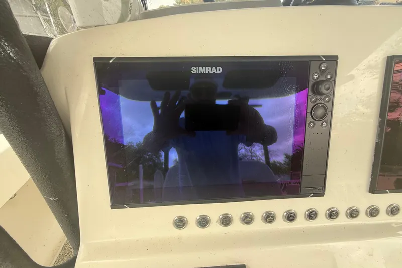 Slide: The Image of Simrad display on Eastward 30 boat dashboard, 2022 model, with visible reflection. - 55