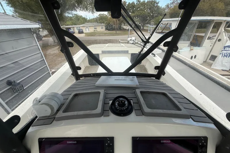 Slide: The Image of Interior view of 2022 Eastward 30 boat cockpit with navigation equipment. - 64