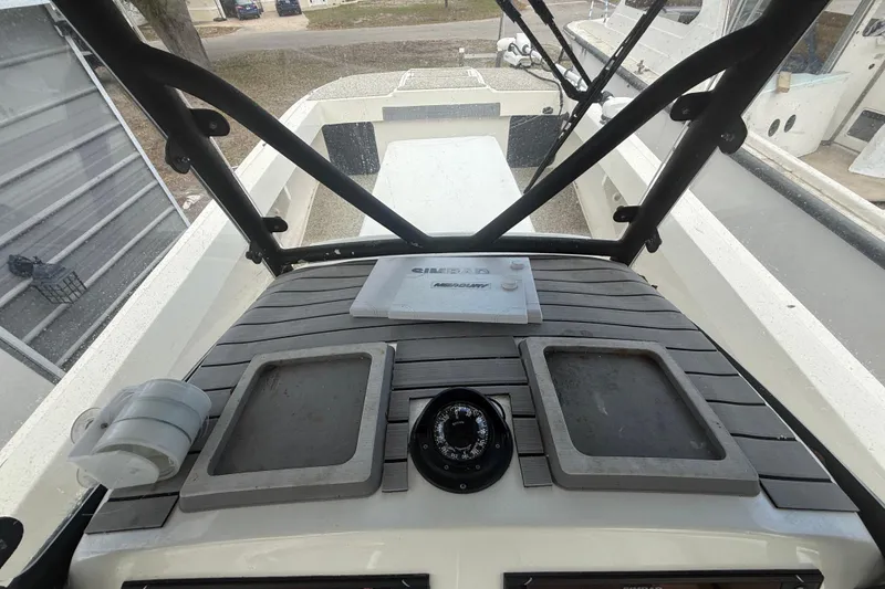 Slide: The Image of Cockpit view of 2022 Eastward 30 boat with navigation equipment and deck features. - 65