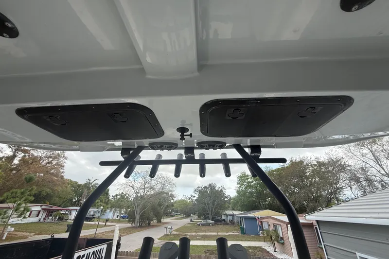 Slide: The Image of 2022 Eastward 30 boat roof view with rod holders and storage compartments. - 69