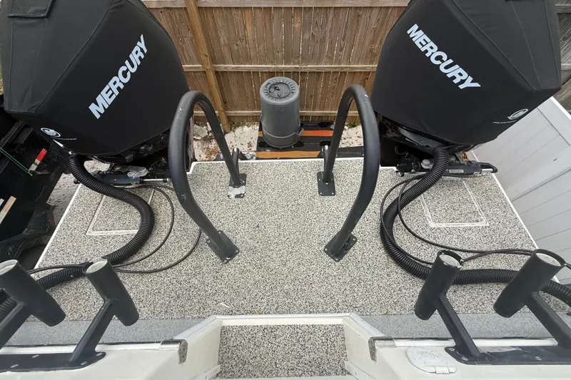 Slide: The Image of Twin Mercury engines on a 2022 Eastward 30 boat, viewed from above. - 78