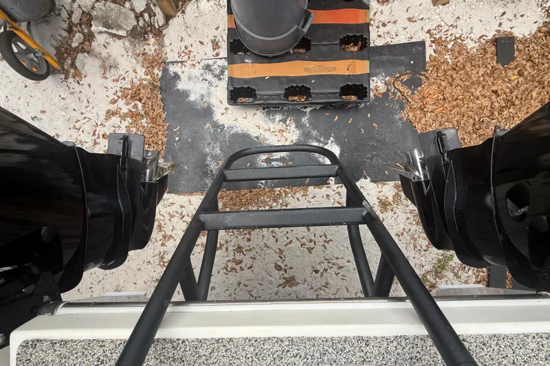 Slide: The Image of Top view of Eastward 30 boat ladder and engines, surrounded by leaves and sand. - 79