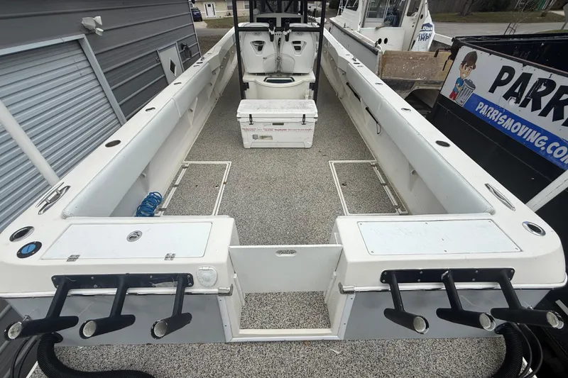 Slide: The Image of Open deck of a 2022 Eastward 30 boat with storage and seating. - 80