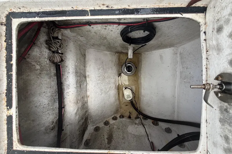 Slide: The Image of Bilge compartment of 2022 Eastward 30 boat with wiring and fittings. - 88