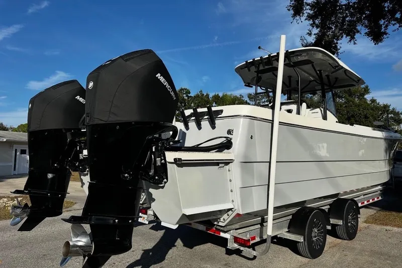 Slide: The Image of 2022 Eastward 30 boat with dual Mercury outboard engines on a trailer. - 9